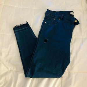 Distressed denim jeans